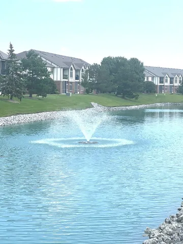a view of a town with mountains front of house