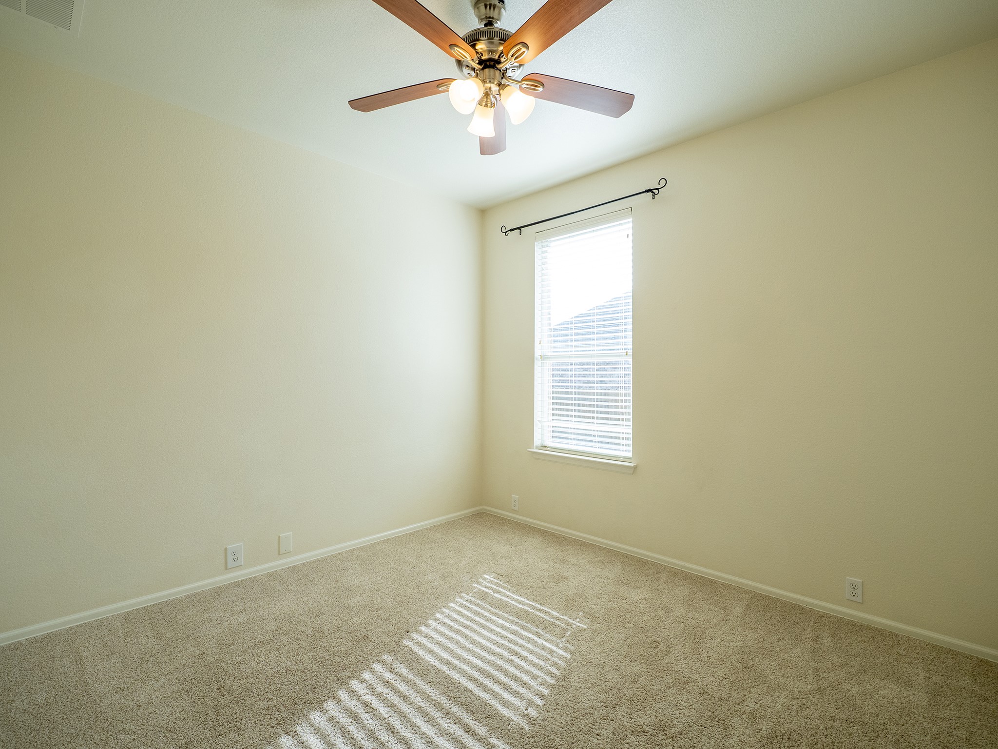 572 Big Meadow Road Austin, TX 78737 - Photo 21 of 32 A well-proportioned bedroom with a window offering natural illumination and an overhead ceiling fan.