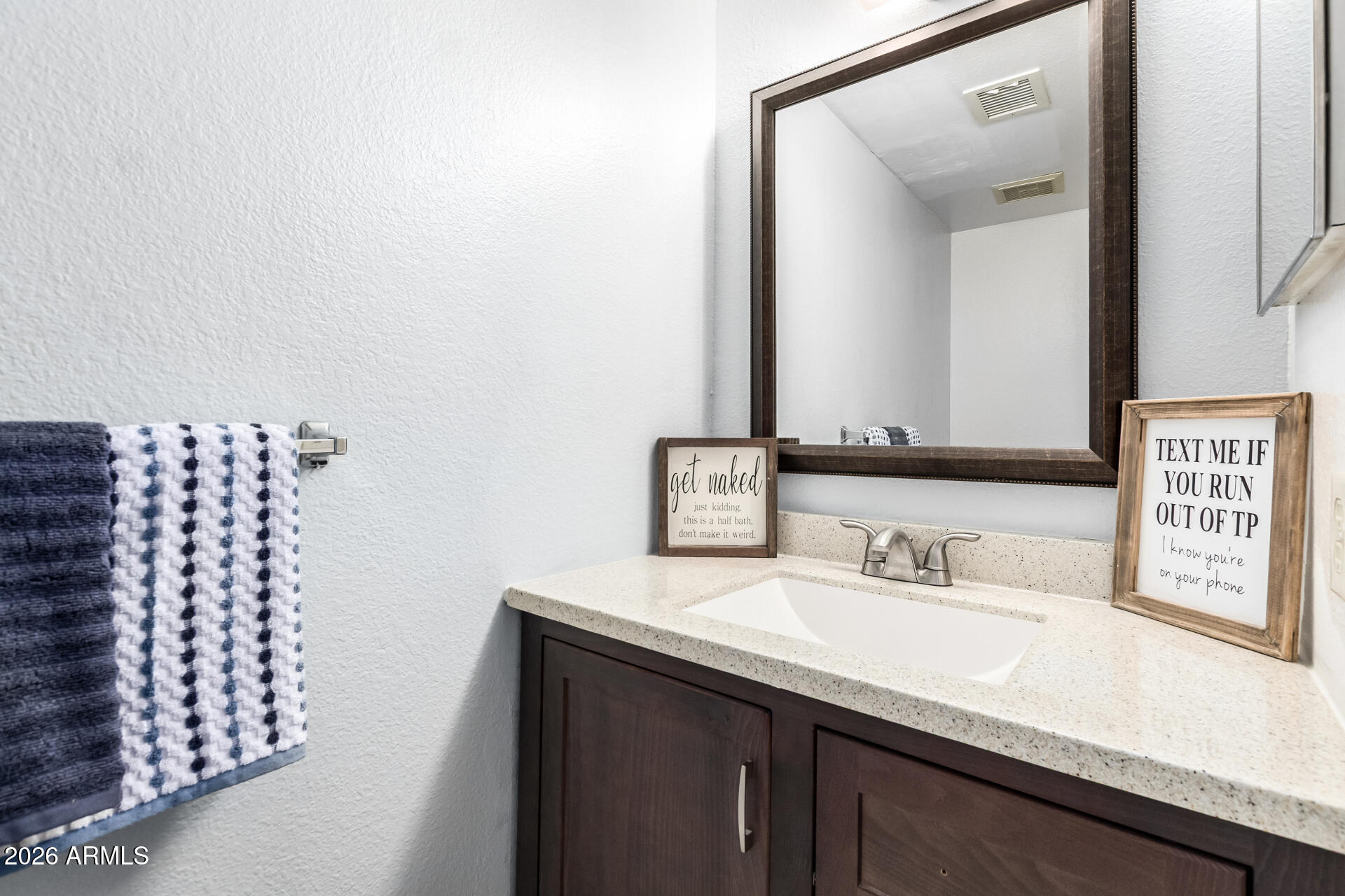 8111 West Wacker Road, Unit 13 Peoria, AZ 85381 - Photo 11 of 28 a bathroom with a sink a mirror and a shower