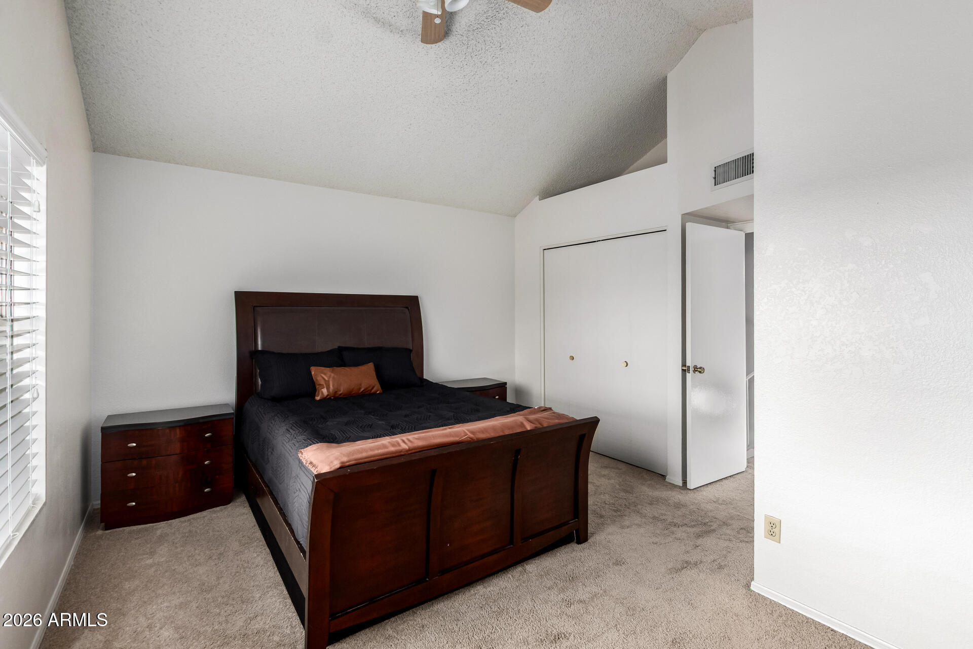 8111 West Wacker Road, Unit 13 Peoria, AZ 85381 - Photo 13 of 28 a bedroom with a bed and a night stand