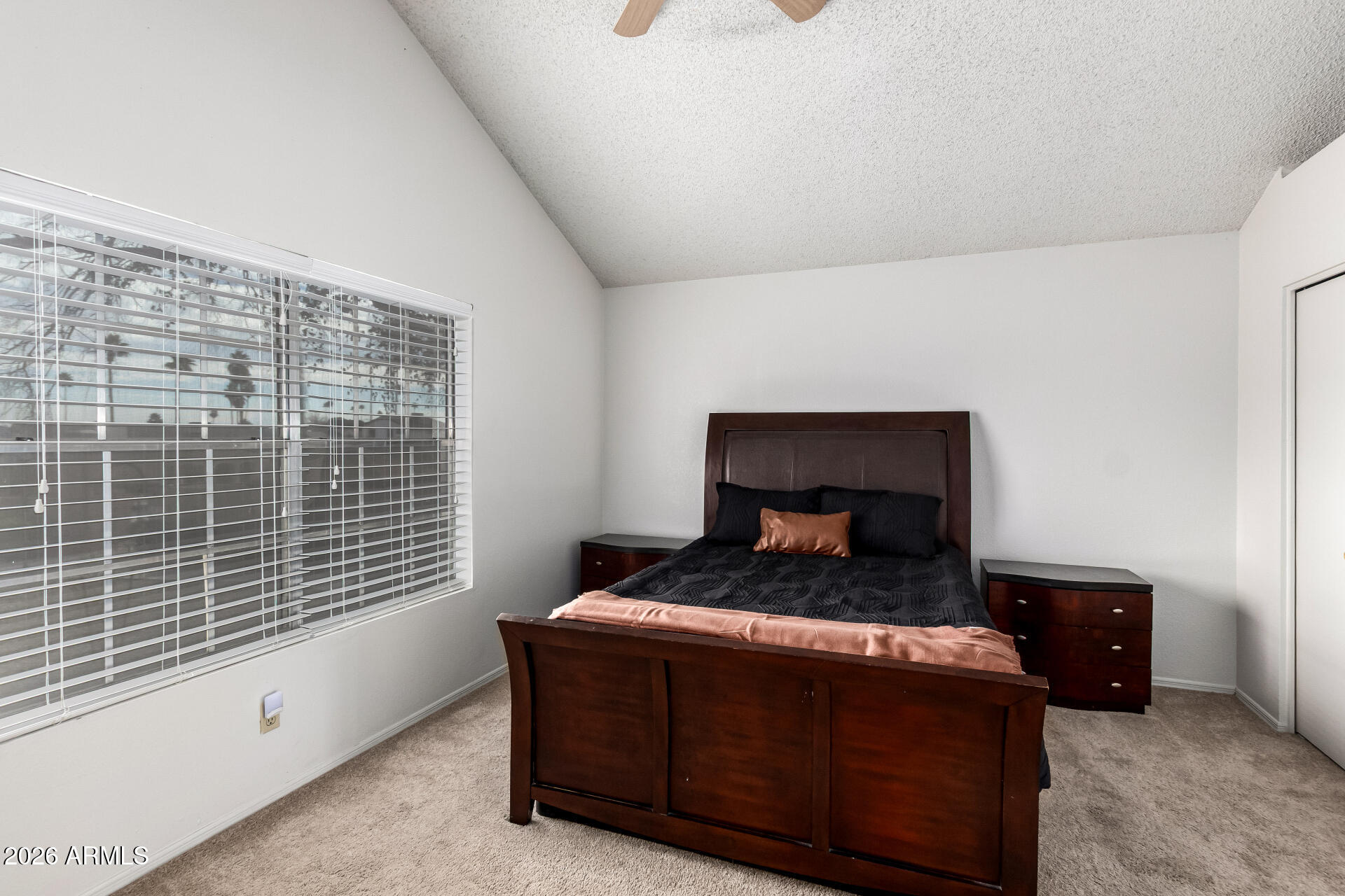 8111 West Wacker Road, Unit 13 Peoria, AZ 85381 - Photo 14 of 28 a bedroom with a bed and a window