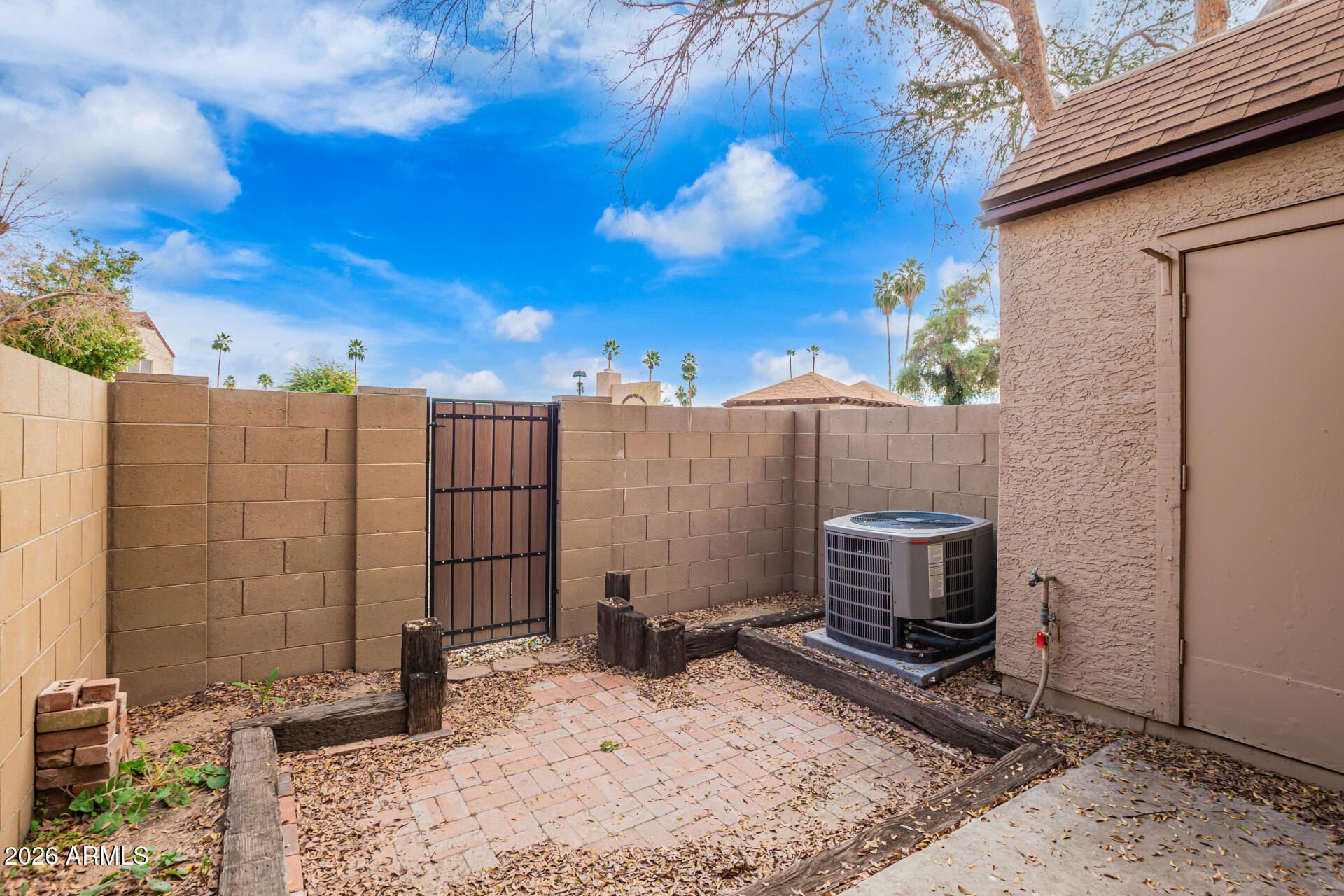 8111 West Wacker Road, Unit 13 Peoria, AZ 85381 - Photo 21 of 28 a view of backyard with a barn and barbeque oven