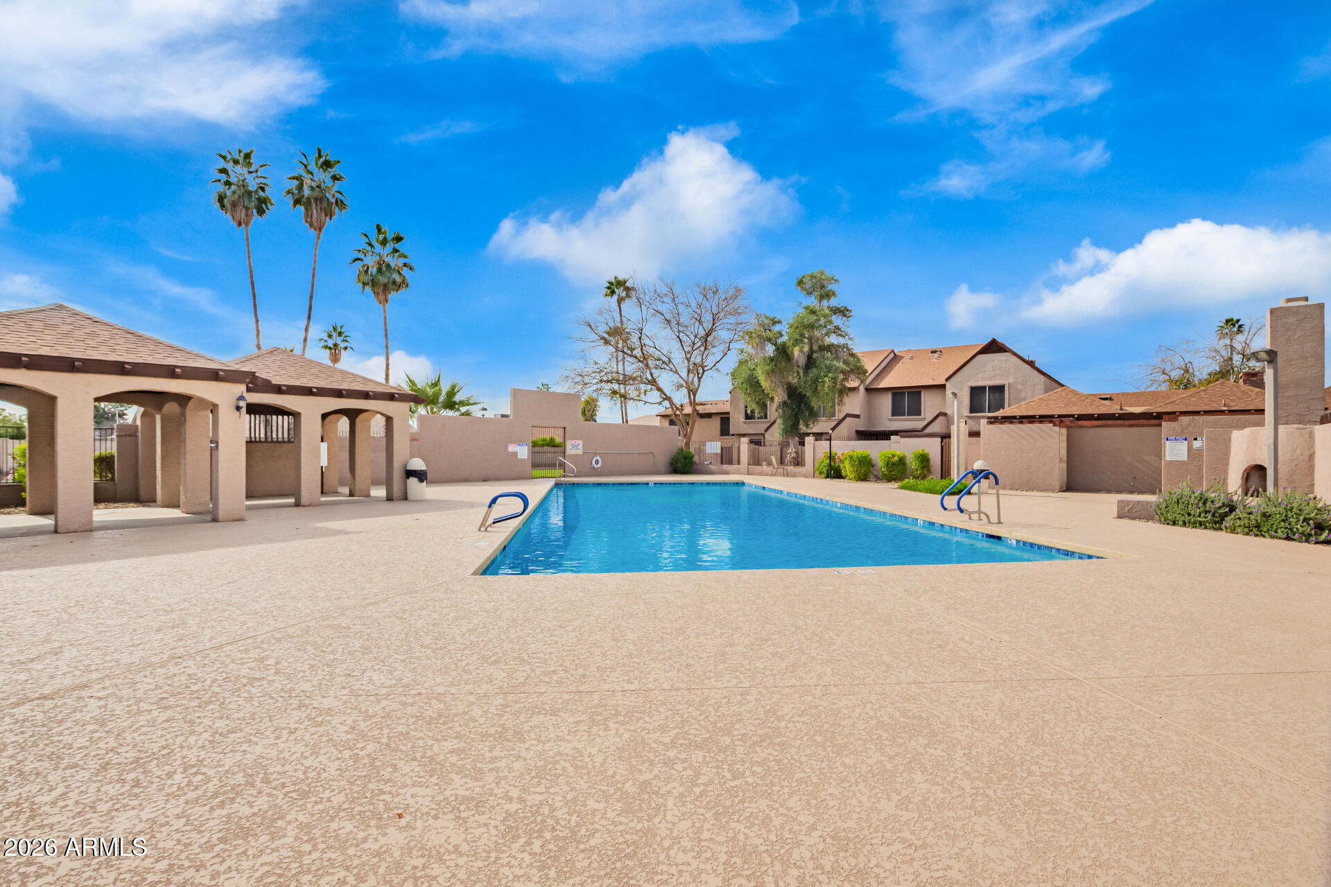 8111 West Wacker Road, Unit 13 Peoria, AZ 85381 - Photo 26 of 28 a view of a house with swimming pool