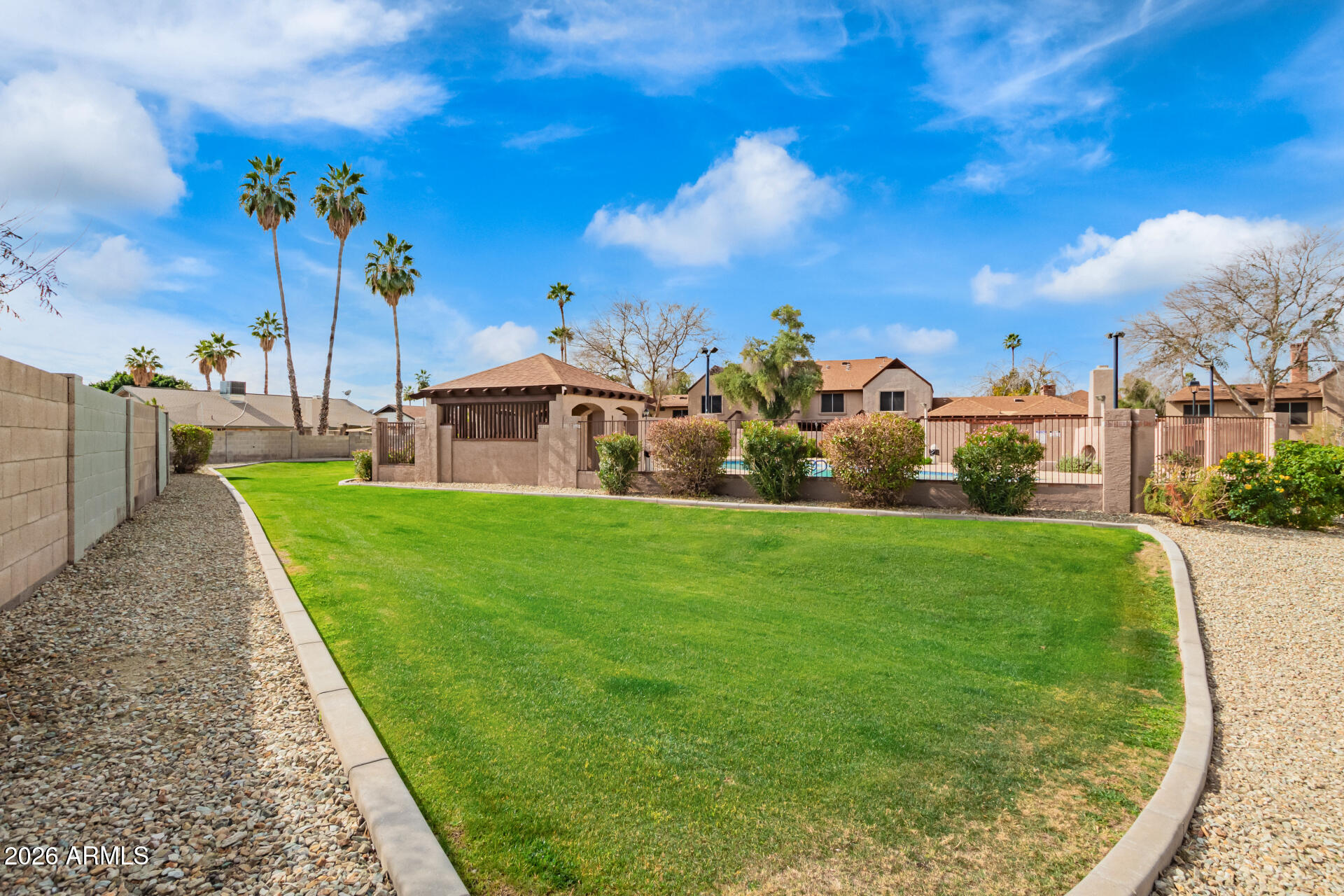 8111 West Wacker Road, Unit 13 Peoria, AZ 85381 - Photo 27 of 28 a front view of a house with garden
