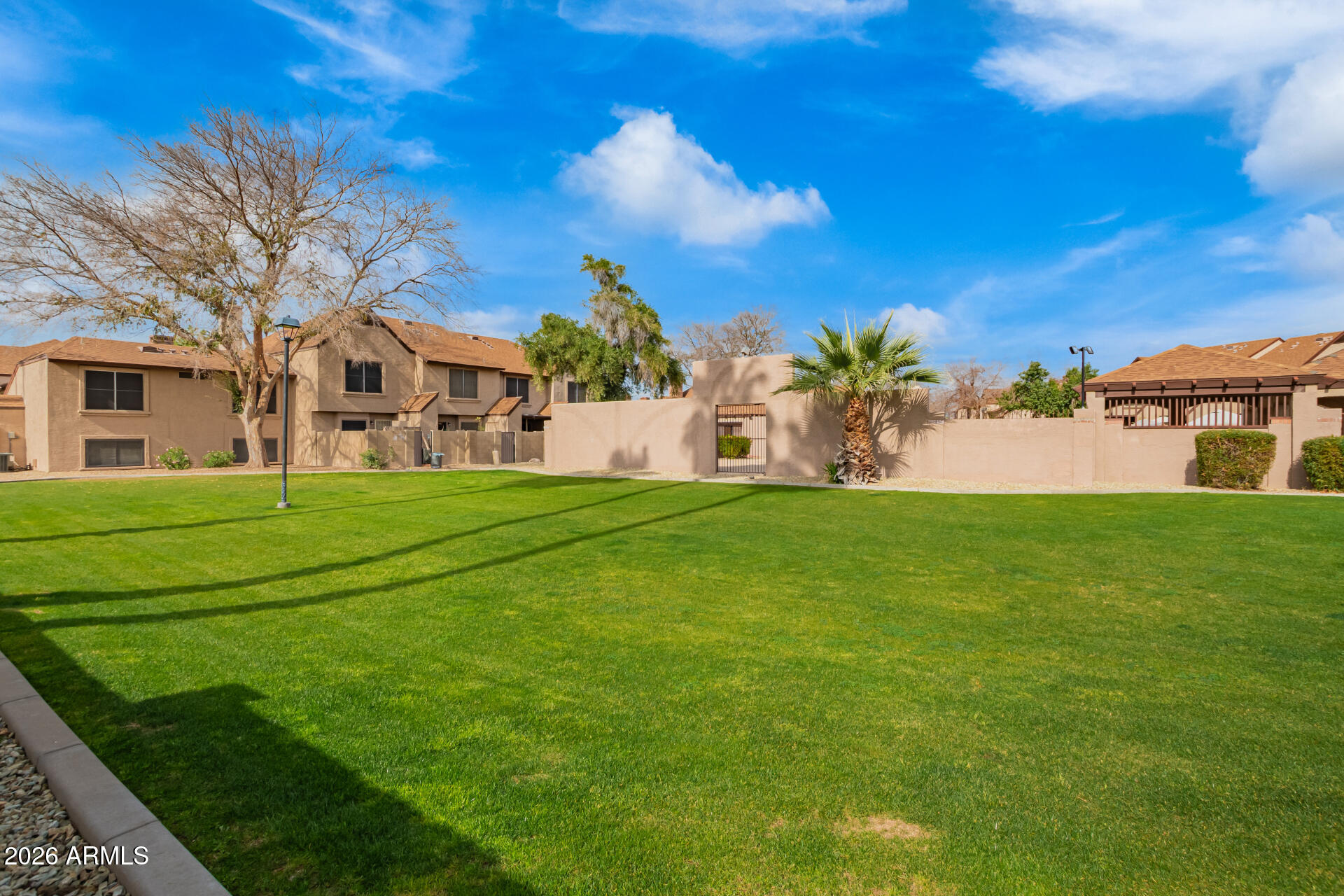 8111 West Wacker Road, Unit 13 Peoria, AZ 85381 - Photo 28 of 28 a view of a house with a big yard
