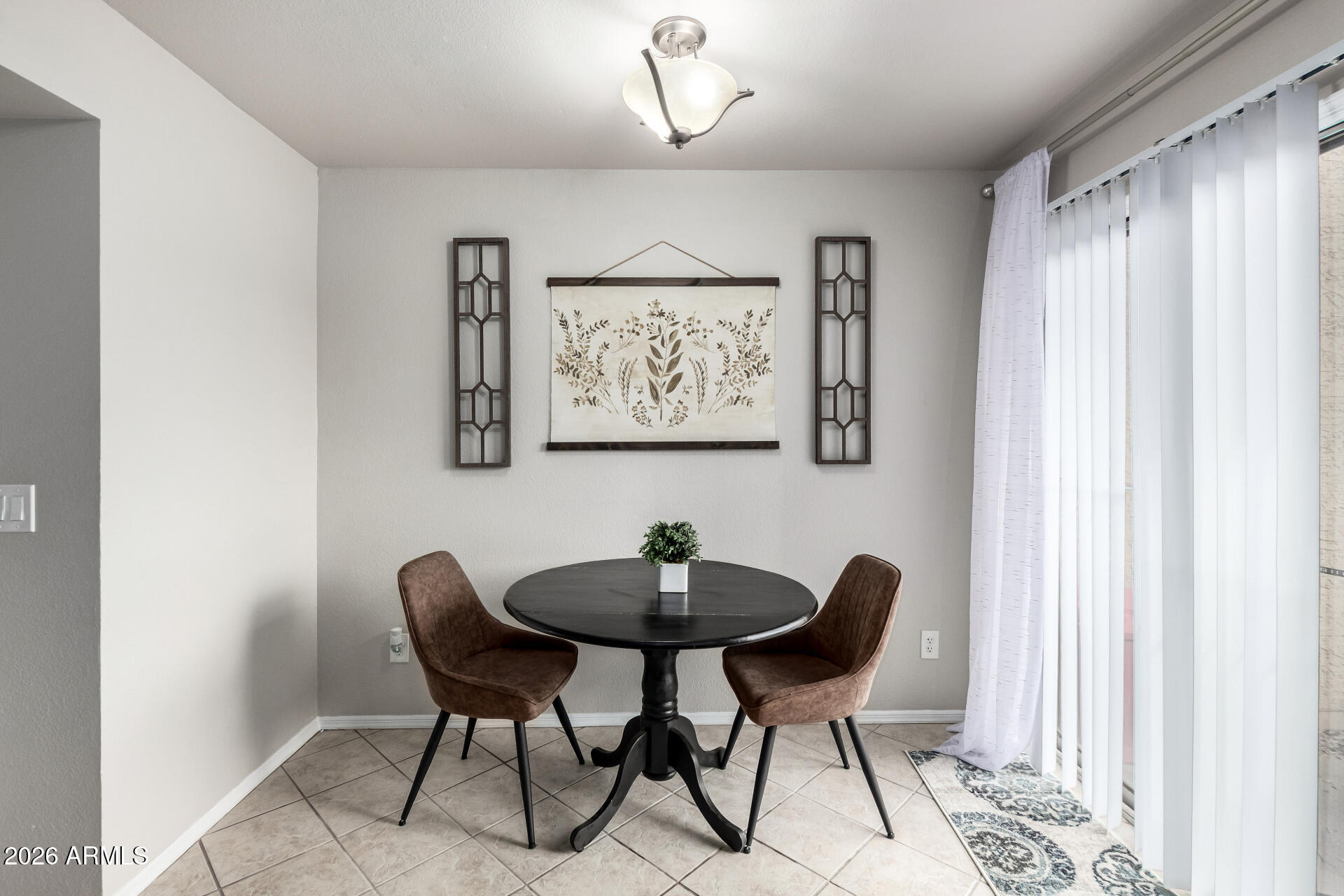 8111 West Wacker Road, Unit 13 Peoria, AZ 85381 - Photo 6 of 28 a view of a dining room with furniture and a window