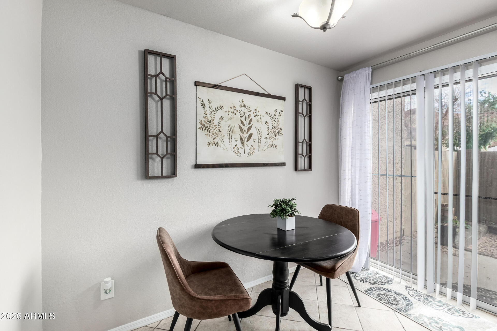 8111 West Wacker Road, Unit 13 Peoria, AZ 85381 - Photo 7 of 28 a view of a room with a table and chairs