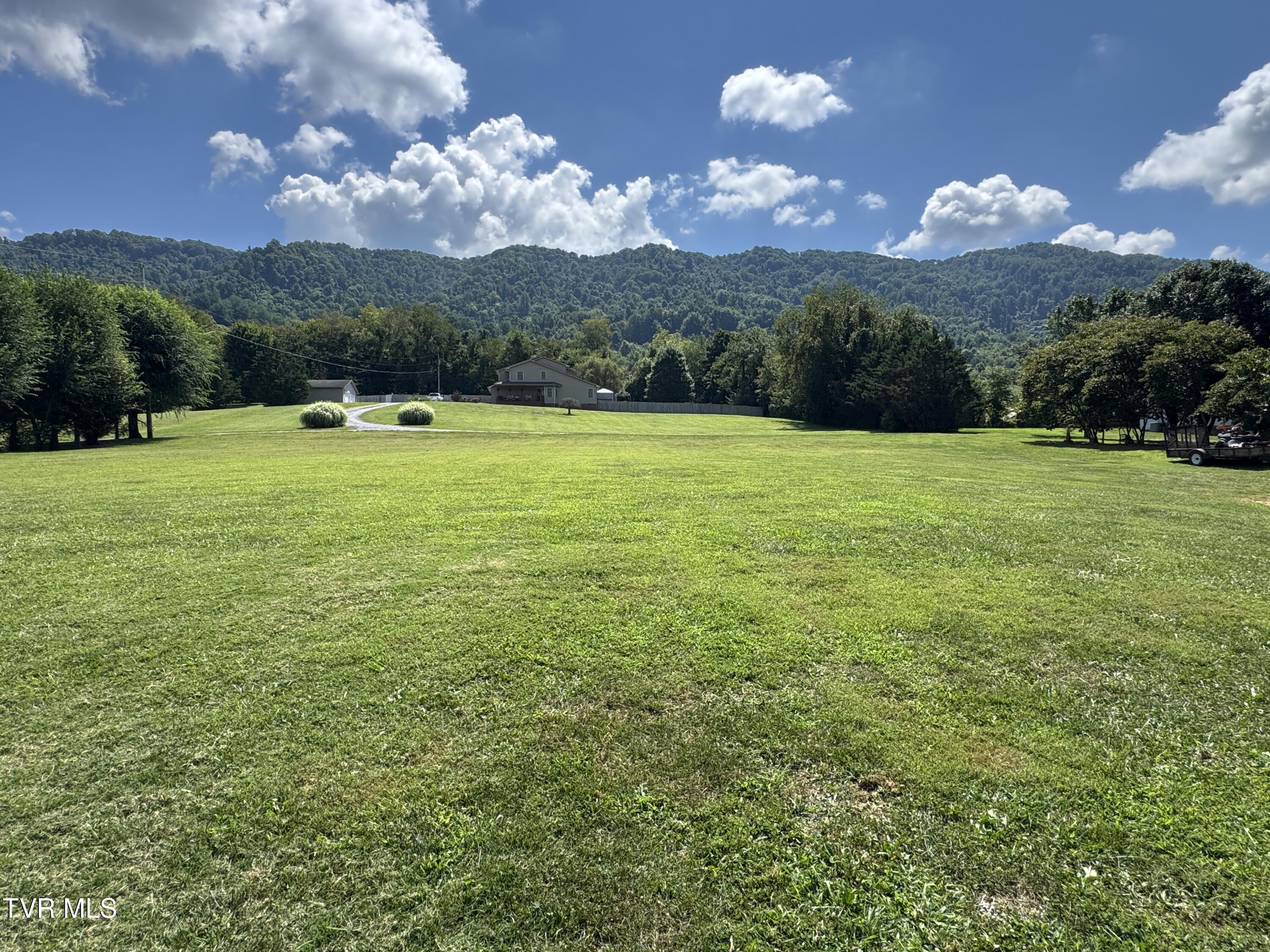 207 Deep Springs Road Dryden, VA 24243 - Photo 37 of 43 VIEW OF FRONT YARD WITH MOUNTAINS