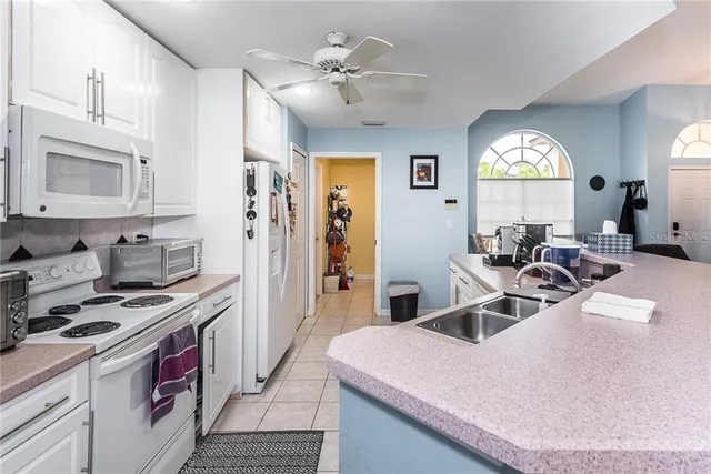 a view of a kitchen sink and a stove