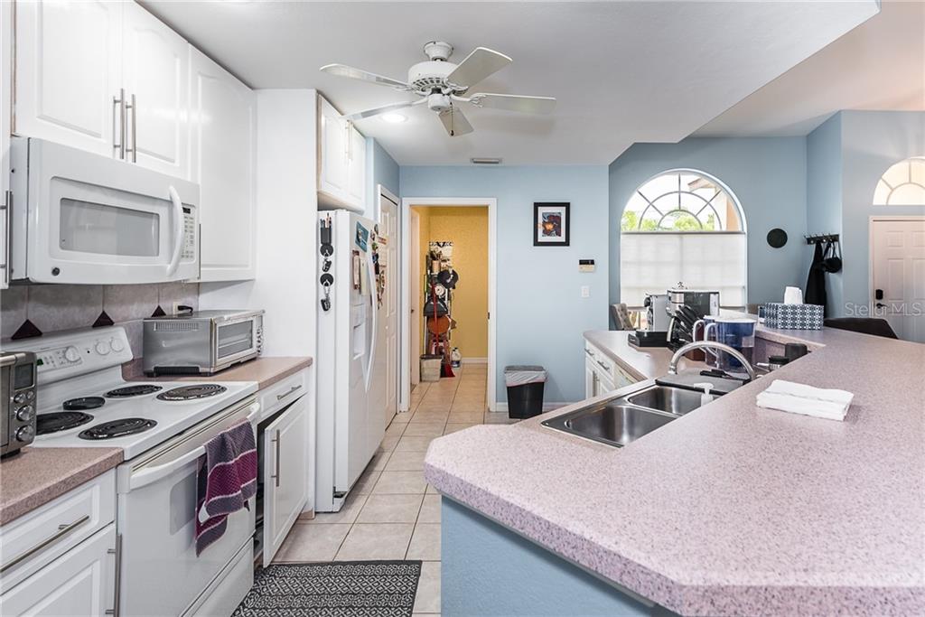 7557 South Blue Sage Punta Gorda, FL 33955 - Photo 11 of 28 a view of a kitchen sink and a stove