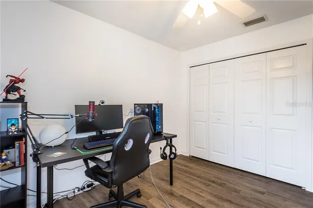 a work room with furniture and wooden floor