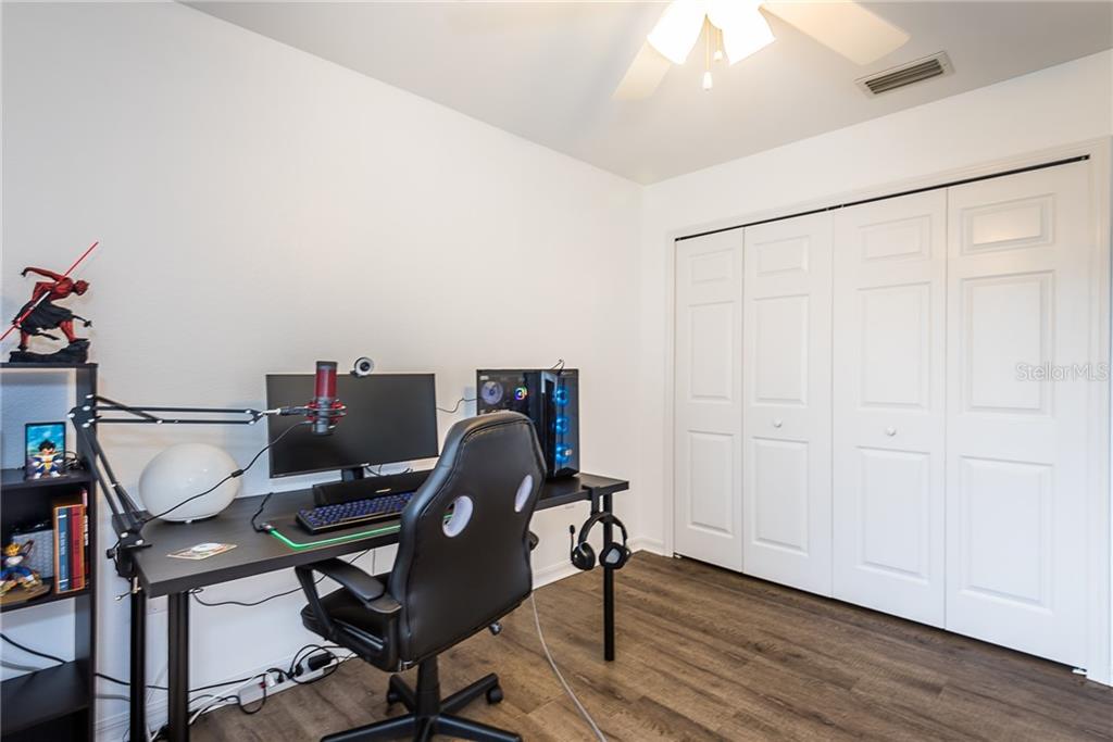 7557 South Blue Sage Punta Gorda, FL 33955 - Photo 16 of 28 a work room with furniture and wooden floor