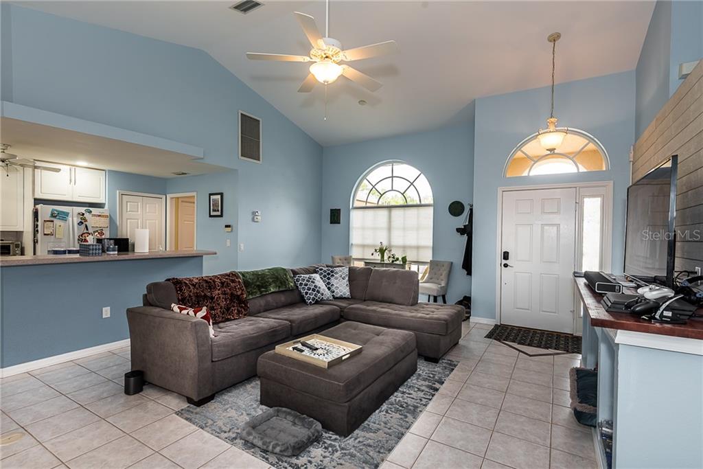 7557 South Blue Sage Punta Gorda, FL 33955 - Photo 3 of 28 a living room with furniture and a large window