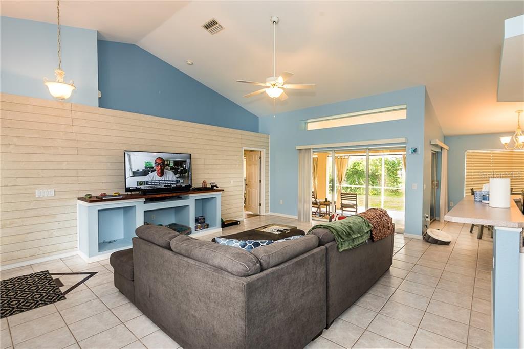 7557 South Blue Sage Punta Gorda, FL 33955 - Photo 6 of 28 a living room with furniture and a large window