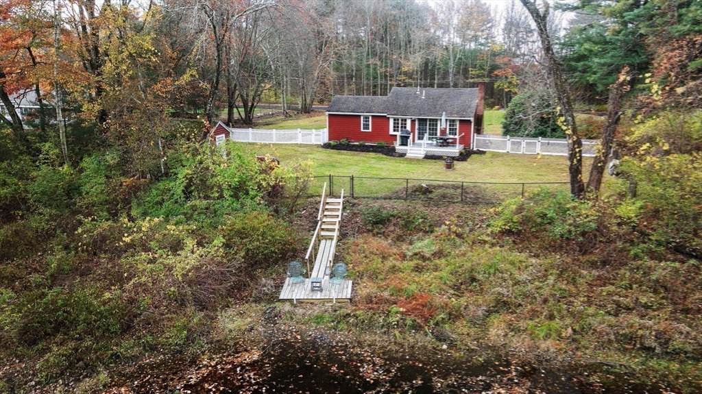 48 River Road Norfolk, MA 02056 - Photo 26 of 42 a view of swimming pool with sitting area and trees around