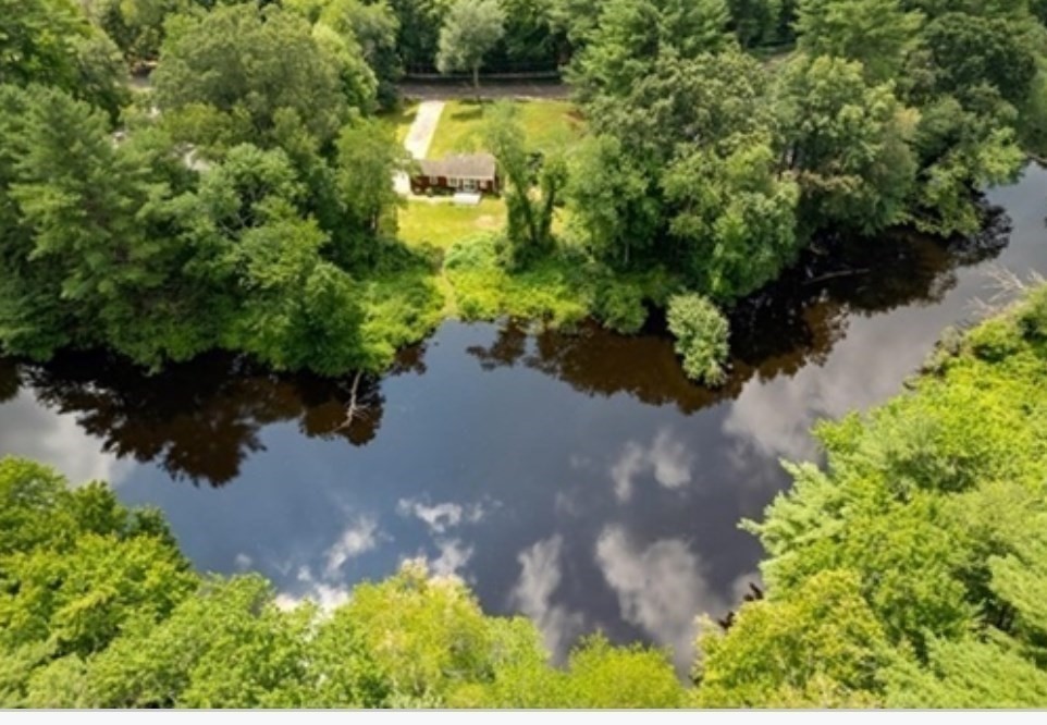 48 River Road Norfolk, MA 02056 - Photo 27 of 42 an aerial view of a house with a yard and lake view