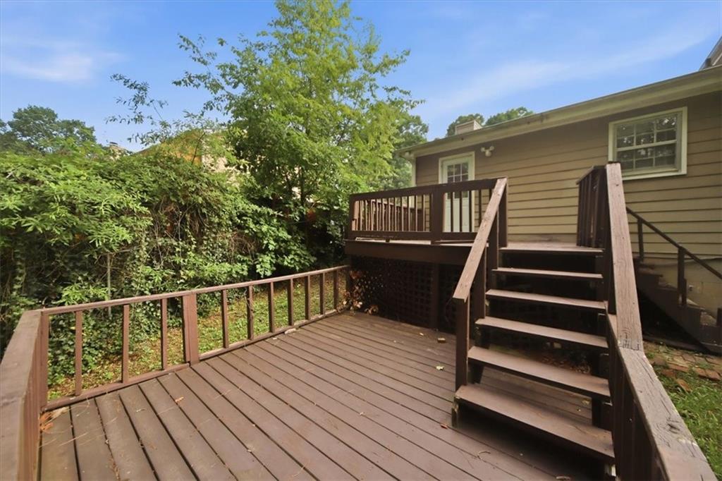 1496 Cherry Hill Road Southwest Conyers, GA 30094 - Photo 24 of 32 a view of balcony with wooden floor and fence