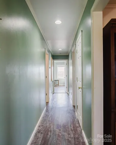a bathroom with a granite countertop sink a toilet and a mirror