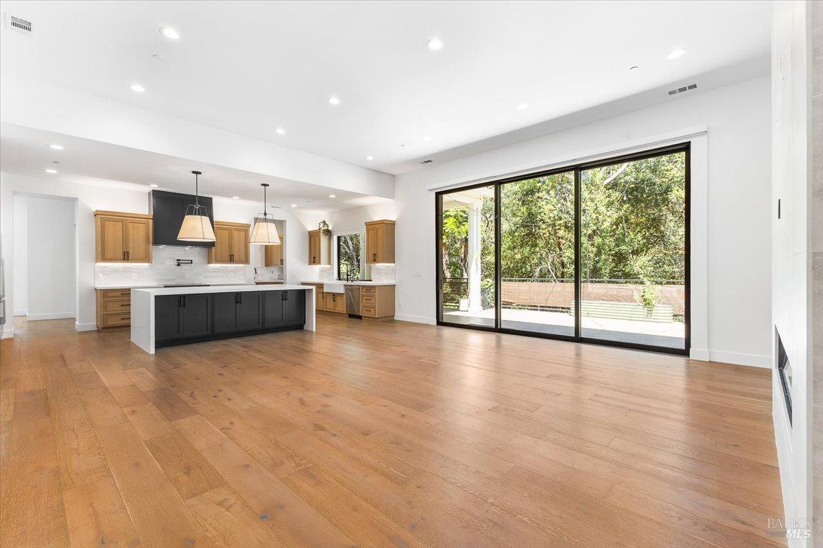 794 Los Olivos Road Santa Rosa, CA 95404 - Photo 21 of 59 a large kitchen with stainless steel appliances a large window and a kitchen view