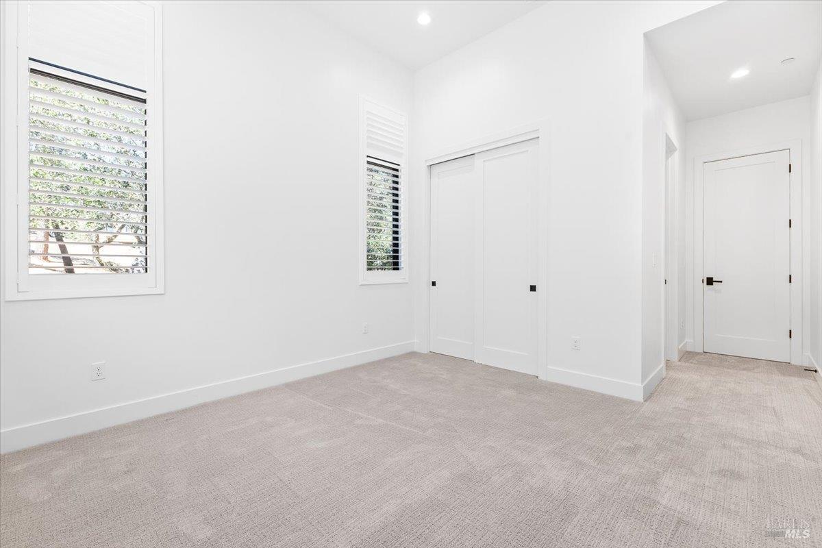 794 Los Olivos Road Santa Rosa, CA 95404 - Photo 34 of 59 an empty room with windows and closet