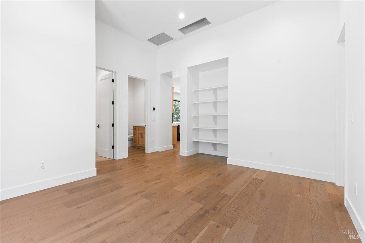 794 Los Olivos Road Santa Rosa, CA 95404 - Photo 37 of 59 a view of empty room with wooden floor