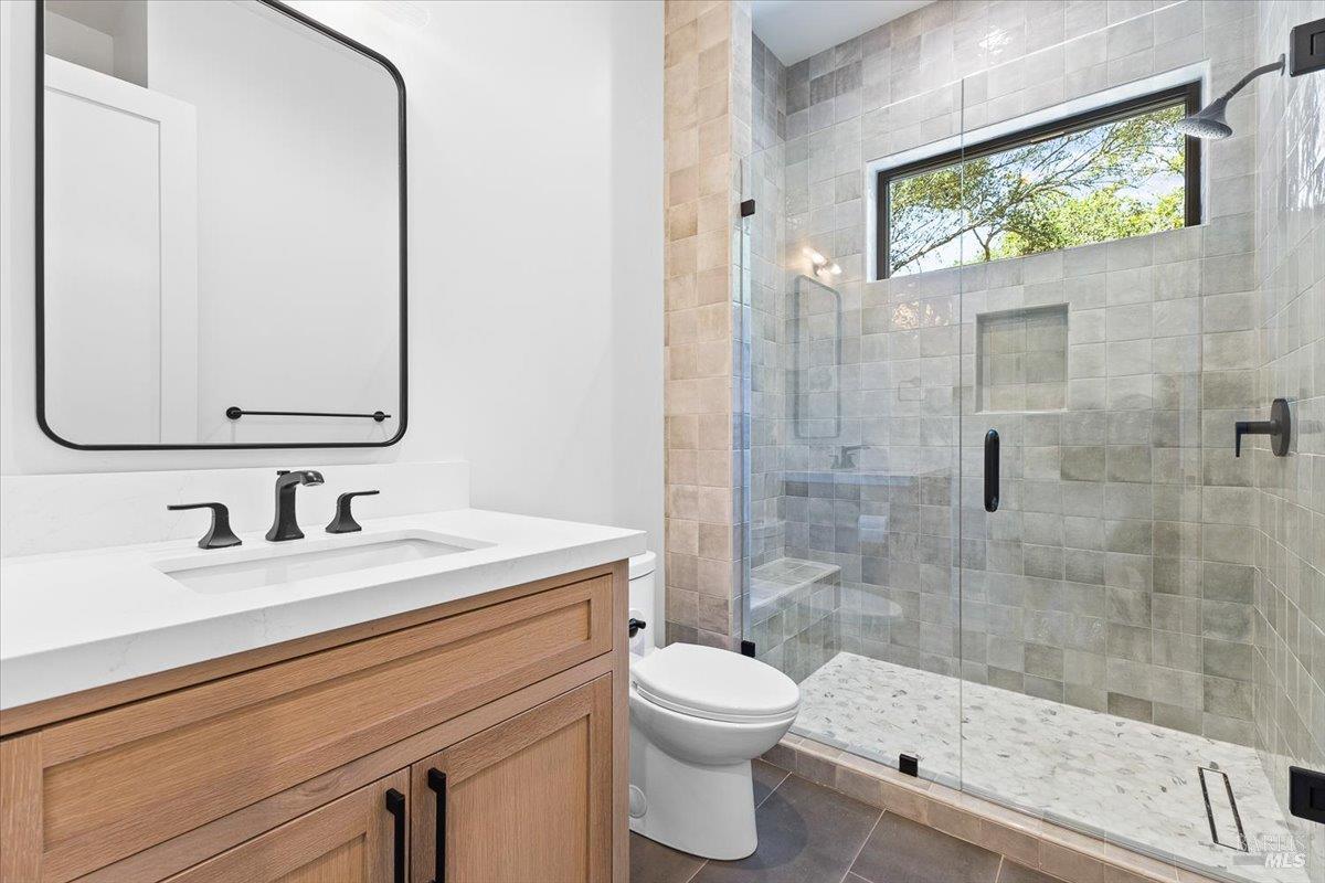 794 Los Olivos Road Santa Rosa, CA 95404 - Photo 41 of 59 a bathroom with a sink a toilet and shower