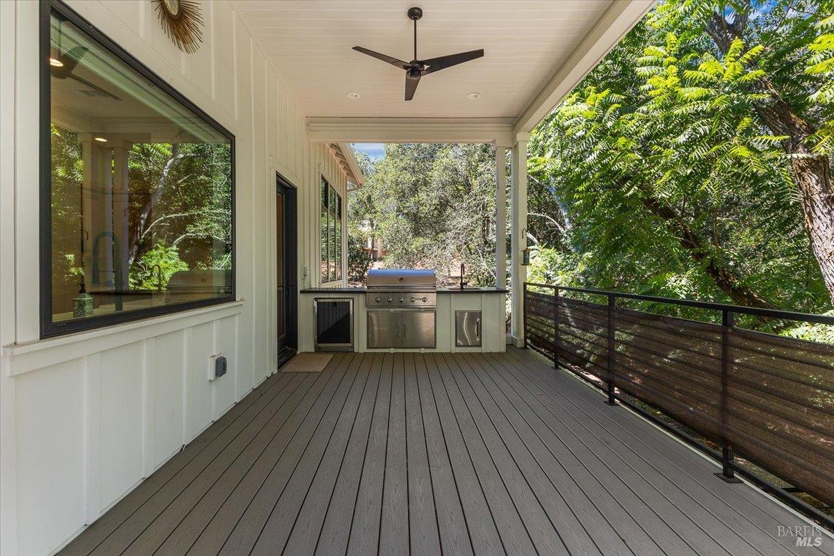 794 Los Olivos Road Santa Rosa, CA 95404 - Photo 43 of 59 a view of a kitchen with a sink and wooden floor