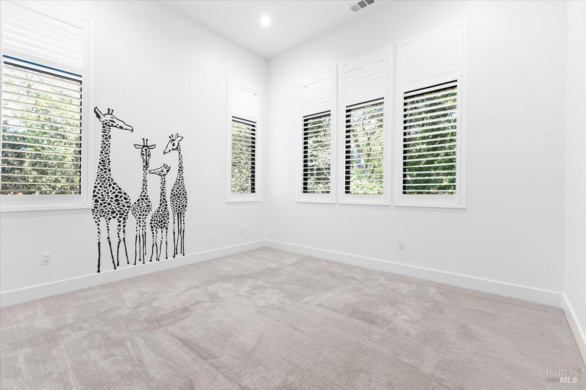 794 Los Olivos Road Santa Rosa, CA 95404 - Photo 43 of 59 an empty room with windows