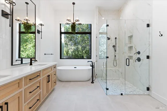 a spacious bathroom with a granite countertop sink a toilet and shower