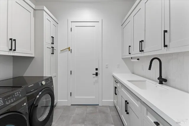 a bathroom with a sink and a washing machine