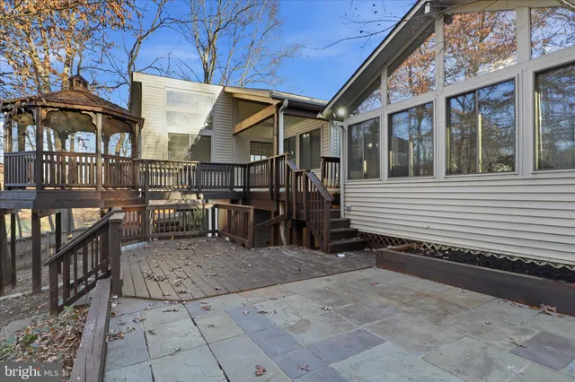 a view of a house with wooden fence
