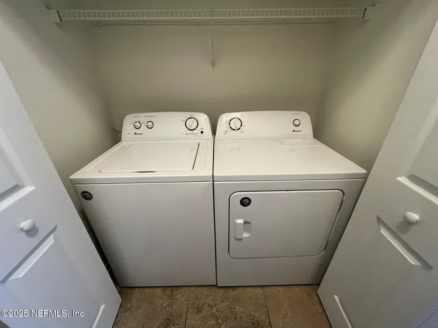 a utility room with dryer and washer
