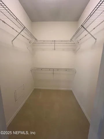 a view of a room with racks on the wall