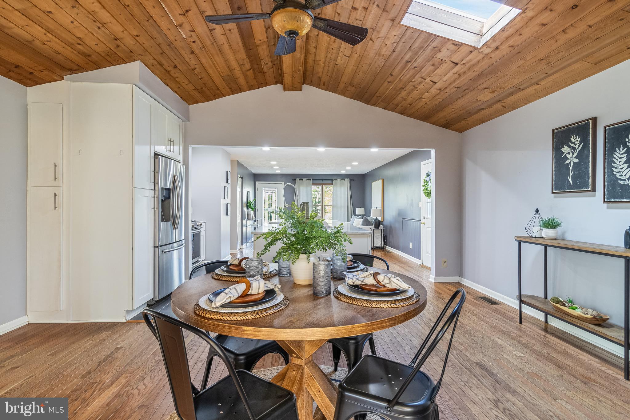 5131 Solomons Island Road Huntingtown, MD 20639 - Photo 14 of 42 a view of a dining room with furniture and wooden floor