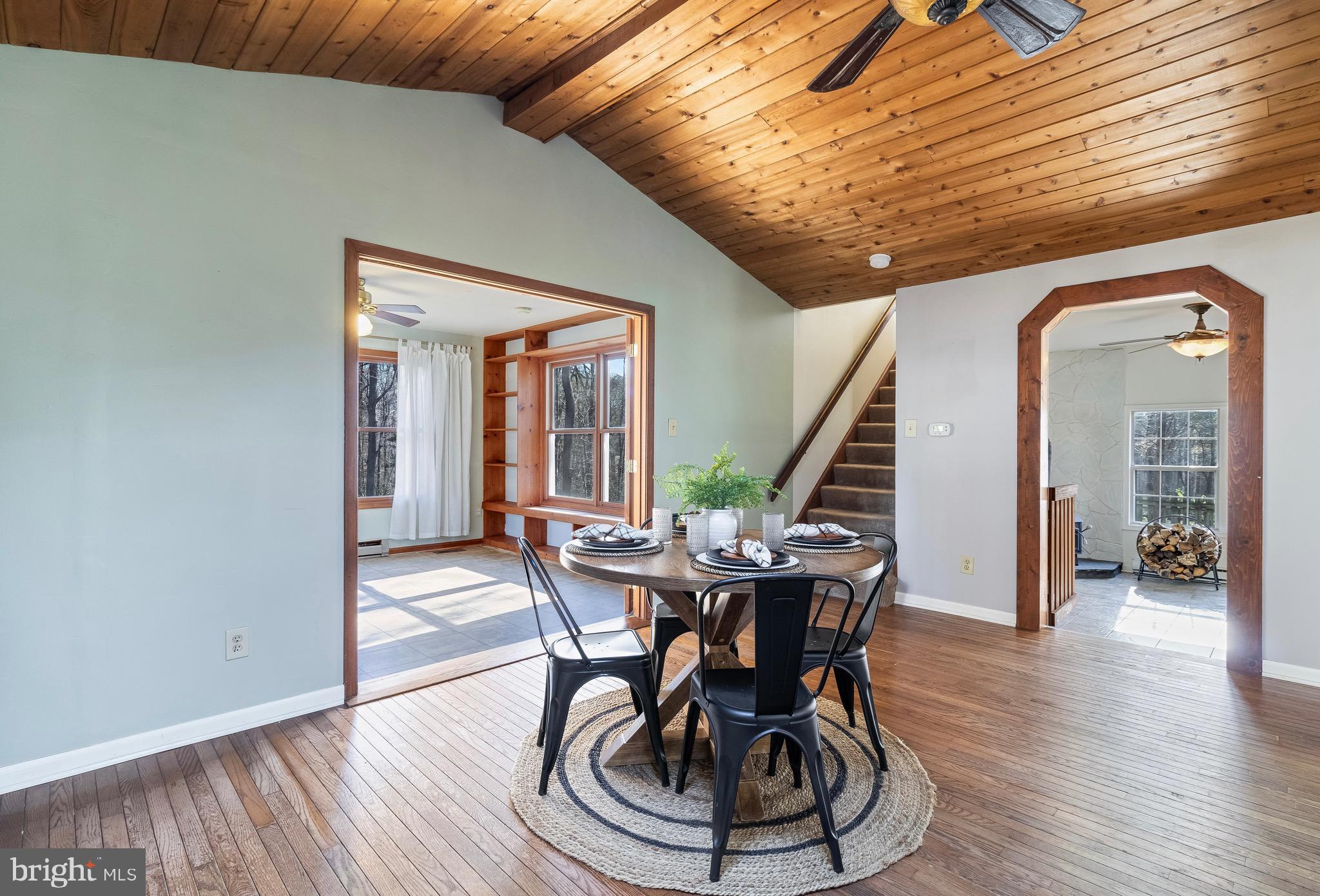 5131 Solomons Island Road Huntingtown, MD 20639 - Photo 18 of 42 a view of a dining room with furniture and wooden floor