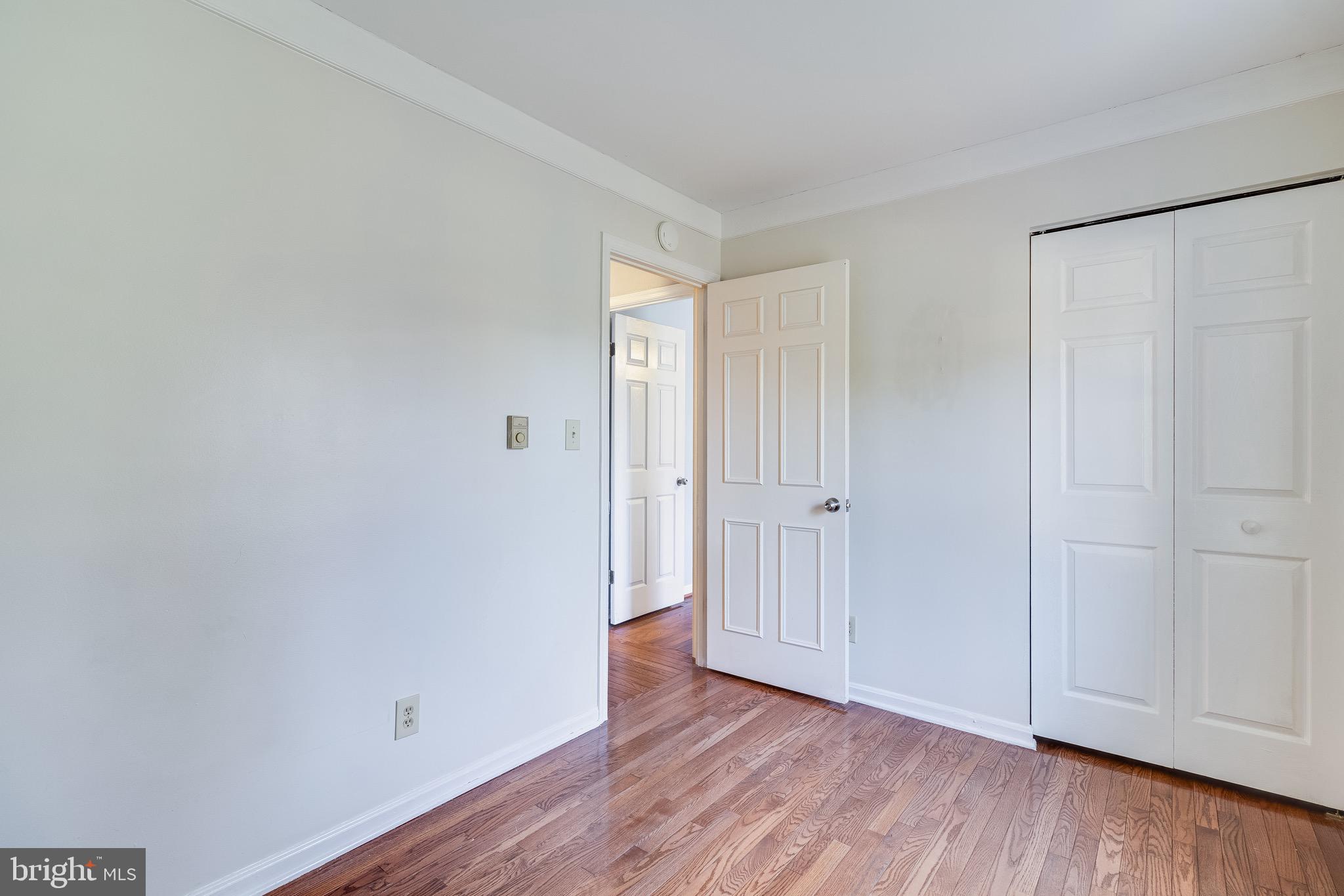 5131 Solomons Island Road Huntingtown, MD 20639 - Photo 24 of 42 a view of an empty room and wooden floor