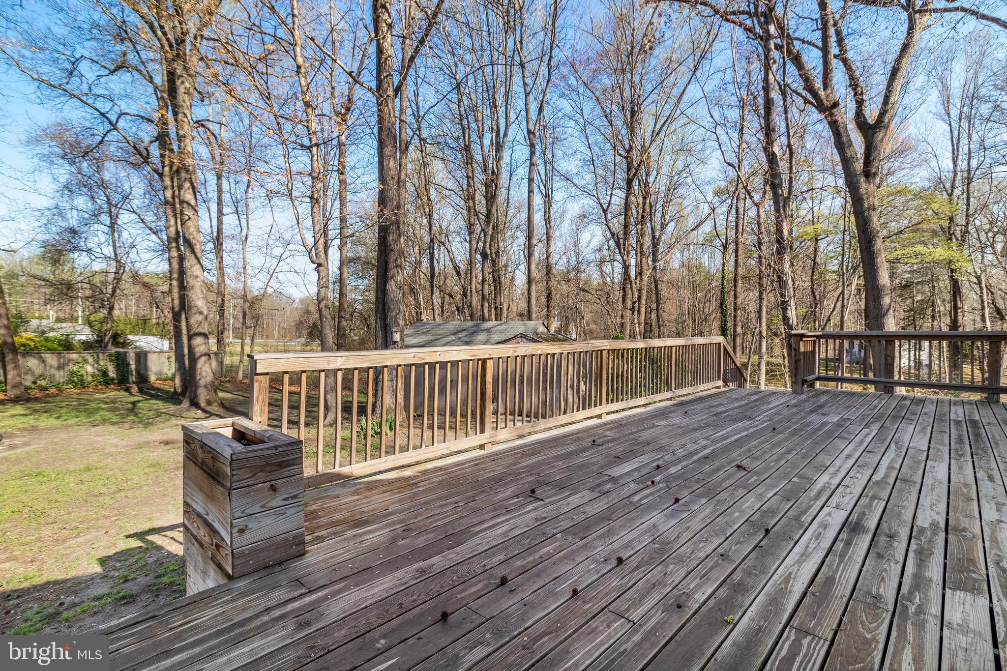 5131 Solomons Island Road Huntingtown, MD 20639 - Photo 34 of 42 a view of a balcony with wooden floor and fence