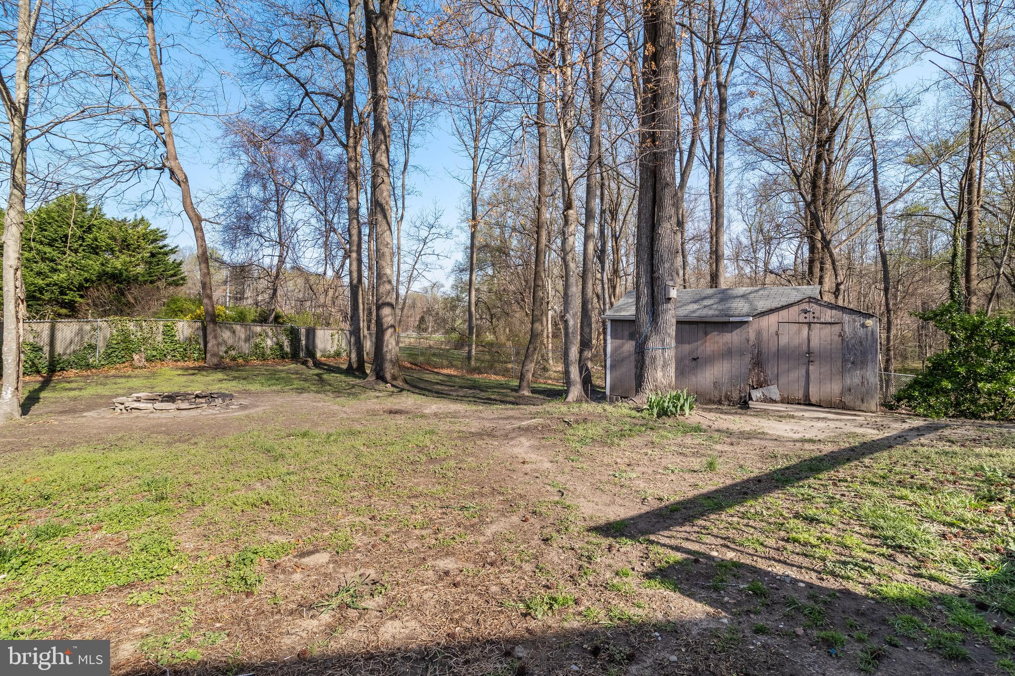 5131 Solomons Island Road Huntingtown, MD 20639 - Photo 36 of 42 a backyard of a house with lots of green space