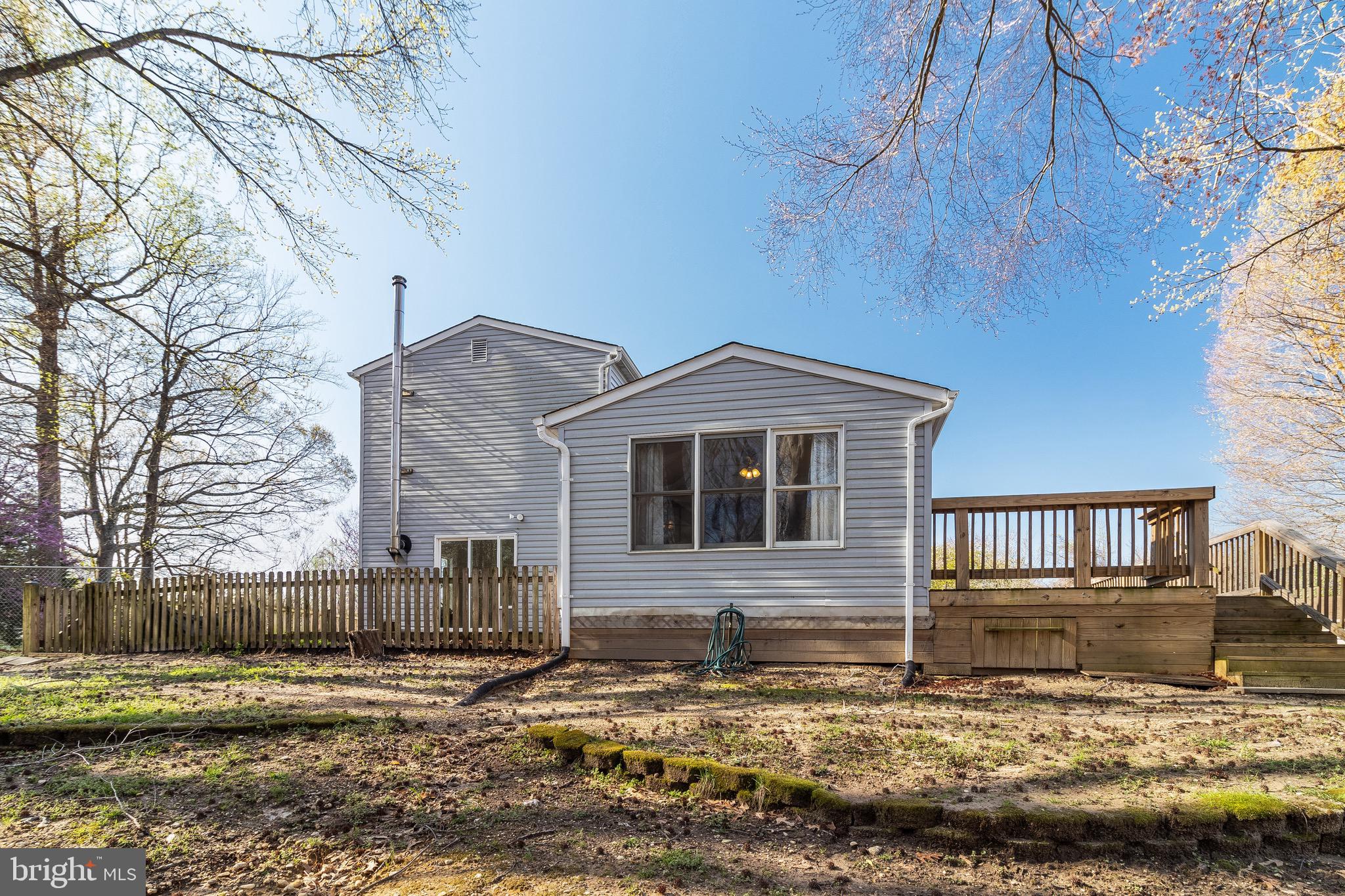 5131 Solomons Island Road Huntingtown, MD 20639 - Photo 38 of 42 a front view of a house with a yard