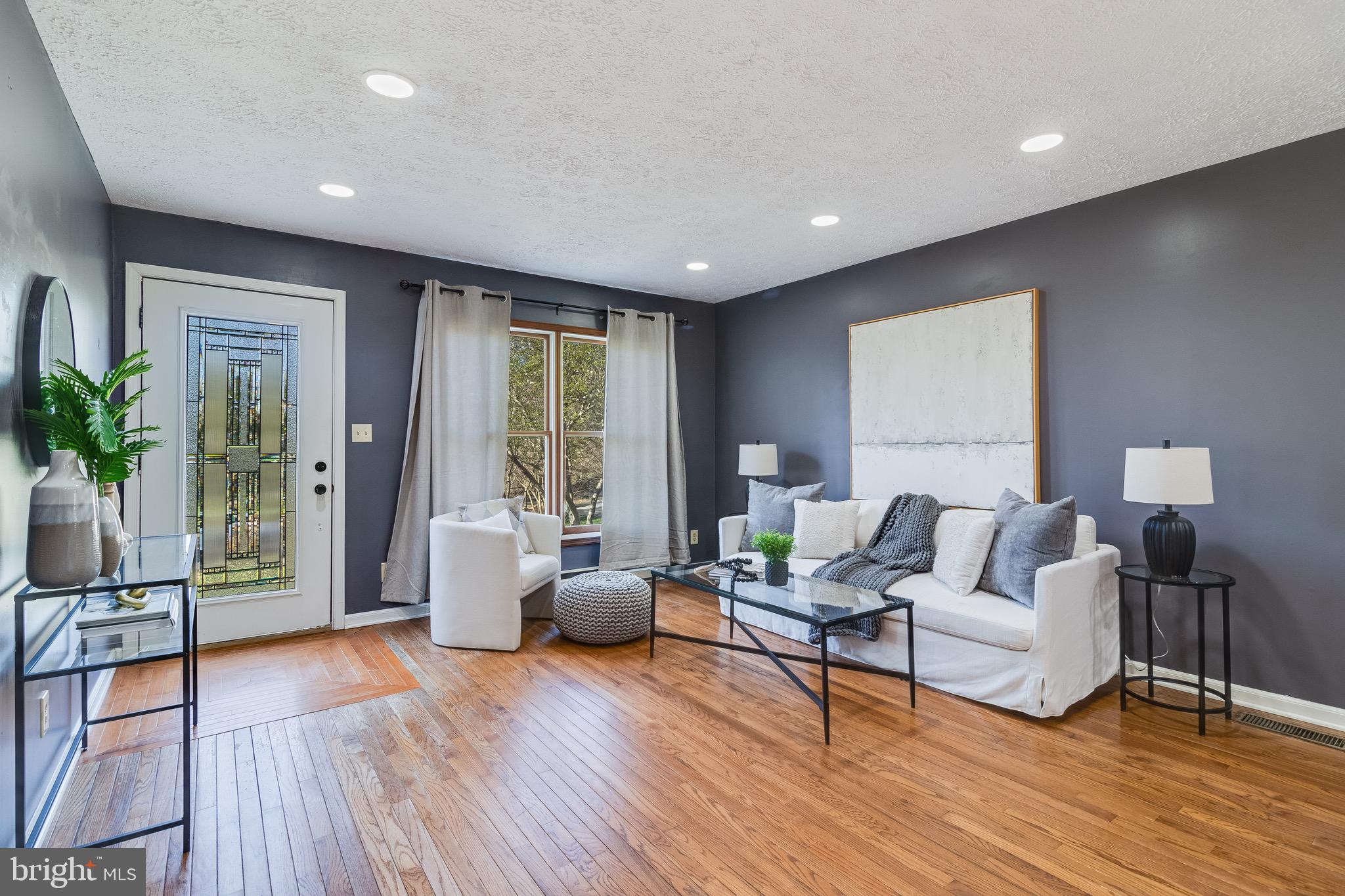 5131 Solomons Island Road Huntingtown, MD 20639 - Photo 5 of 42 a living room with furniture and wooden floor