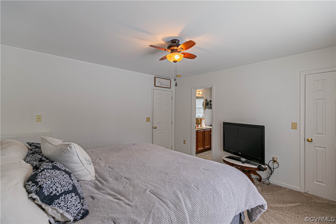 213 Cedar Ridge Drive Ruther Glen, VA 22546 - Photo 13 of 50 a bedroom with a bed and a flat screen tv