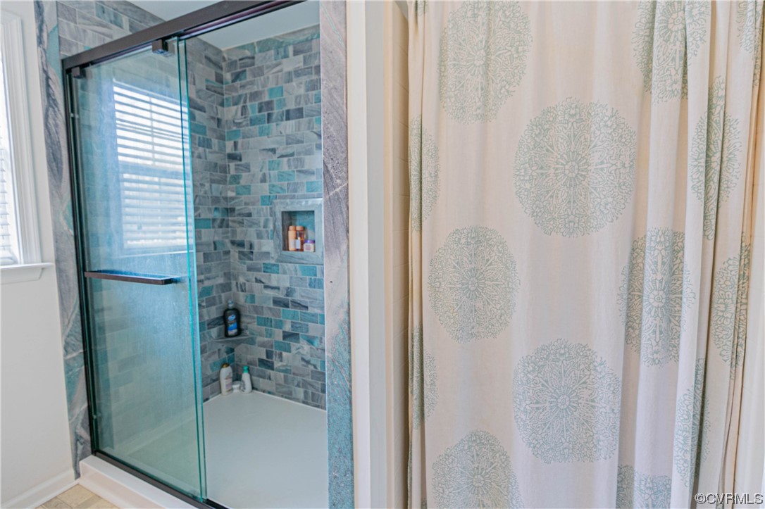 213 Cedar Ridge Drive Ruther Glen, VA 22546 - Photo 14 of 50 a bathroom with a shower