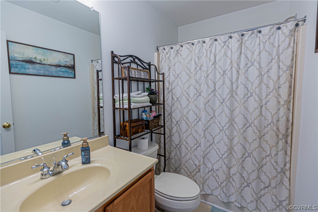 213 Cedar Ridge Drive Ruther Glen, VA 22546 - Photo 19 of 50 a bathroom with a sink toilet and shower