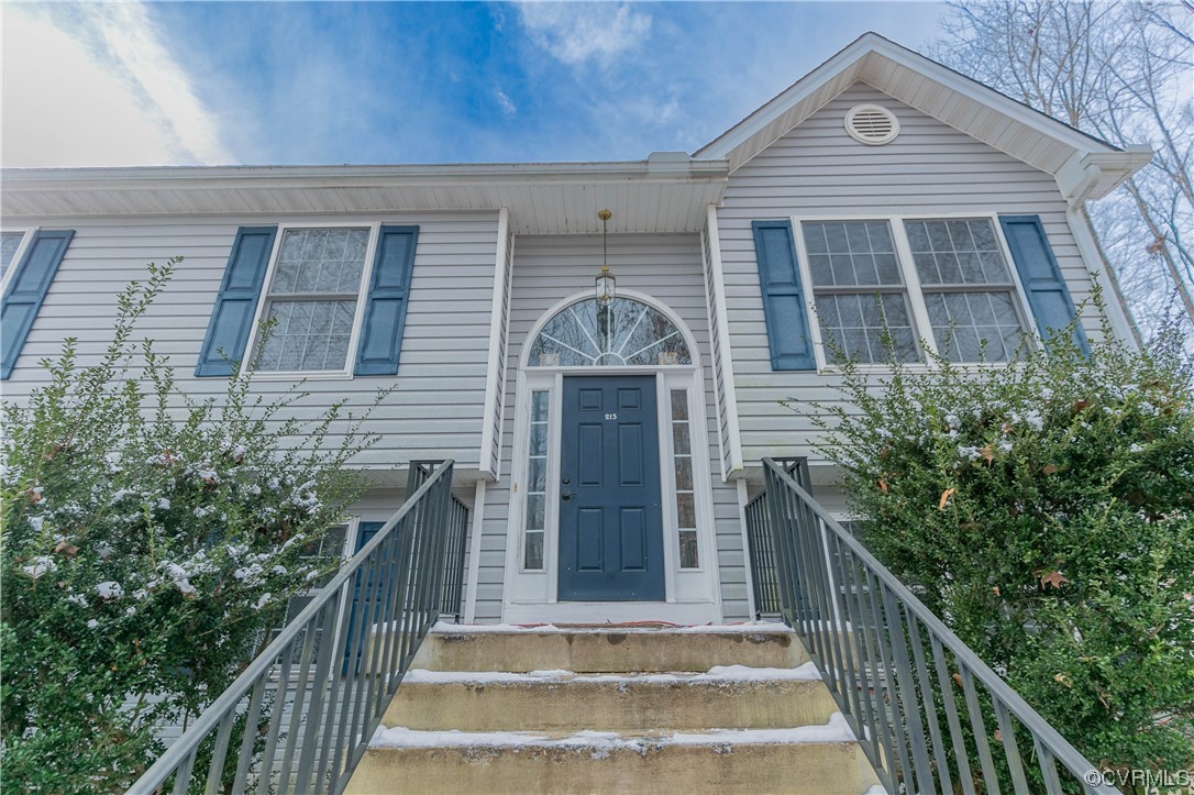 213 Cedar Ridge Drive Ruther Glen, VA 22546 - Photo 2 of 50 a front view of a house with a front door