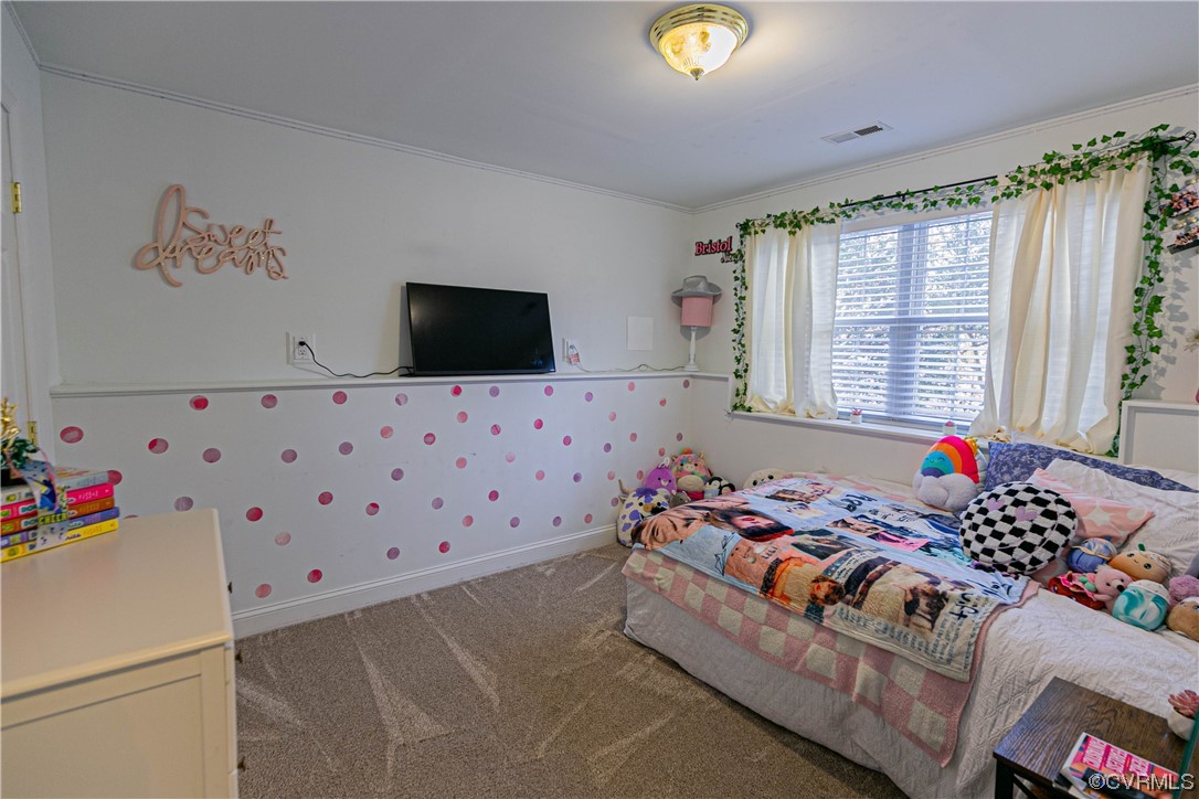 213 Cedar Ridge Drive Ruther Glen, VA 22546 - Photo 23 of 50 a bedroom with a bed and a flat screen tv