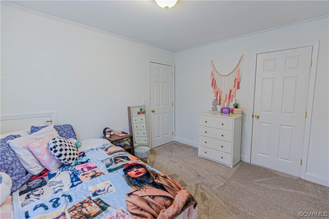 213 Cedar Ridge Drive Ruther Glen, VA 22546 - Photo 24 of 50 a bedroom with a bed and a closet