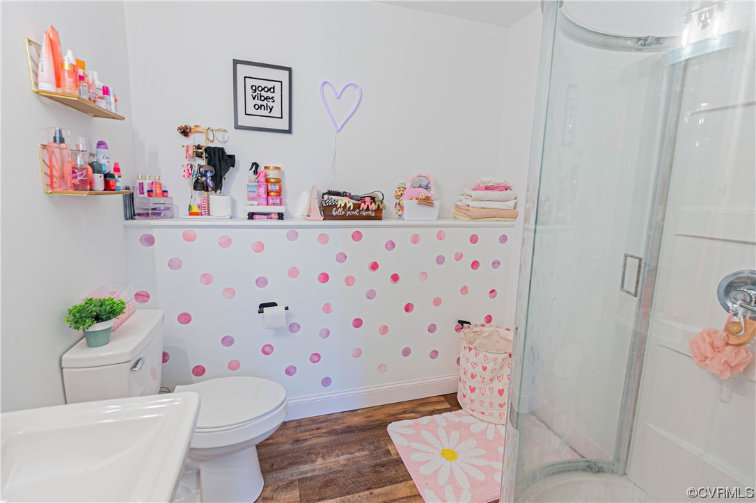 213 Cedar Ridge Drive Ruther Glen, VA 22546 - Photo 25 of 50 a bathroom with a sink toilet and a shower
