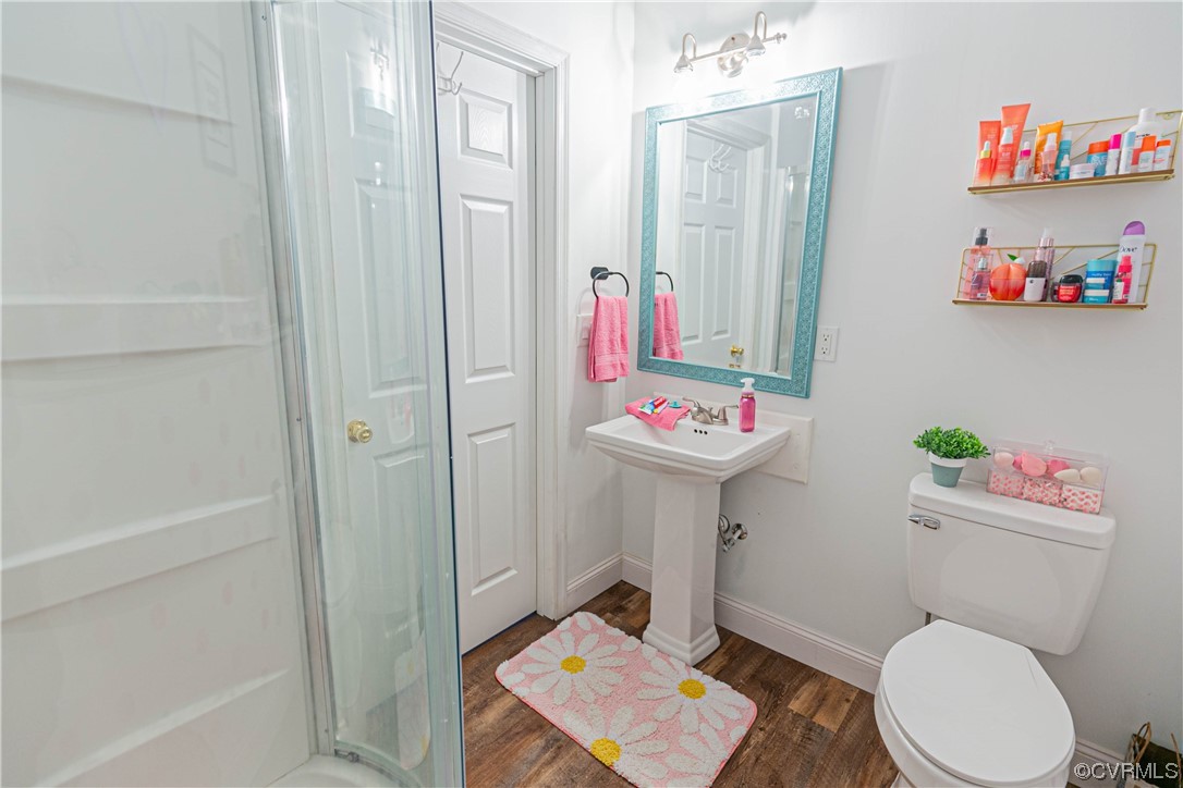 213 Cedar Ridge Drive Ruther Glen, VA 22546 - Photo 26 of 50 a bathroom with a sink toilet and a shower