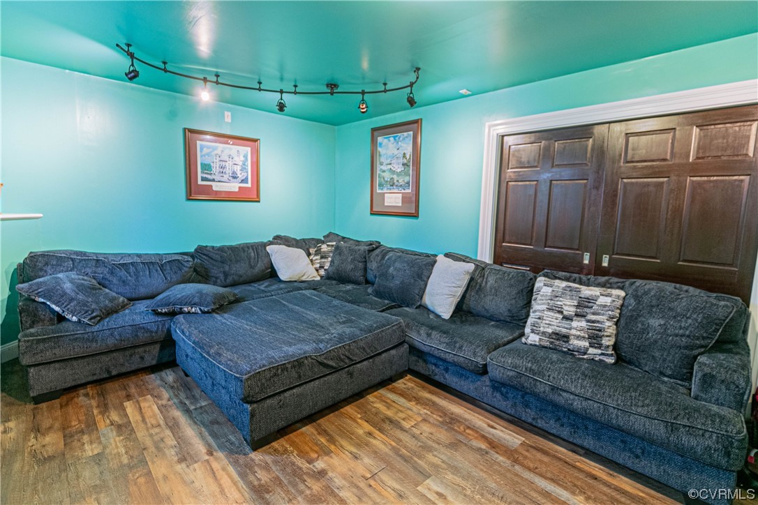 213 Cedar Ridge Drive Ruther Glen, VA 22546 - Photo 27 of 50 a living room with furniture and a wooden floor