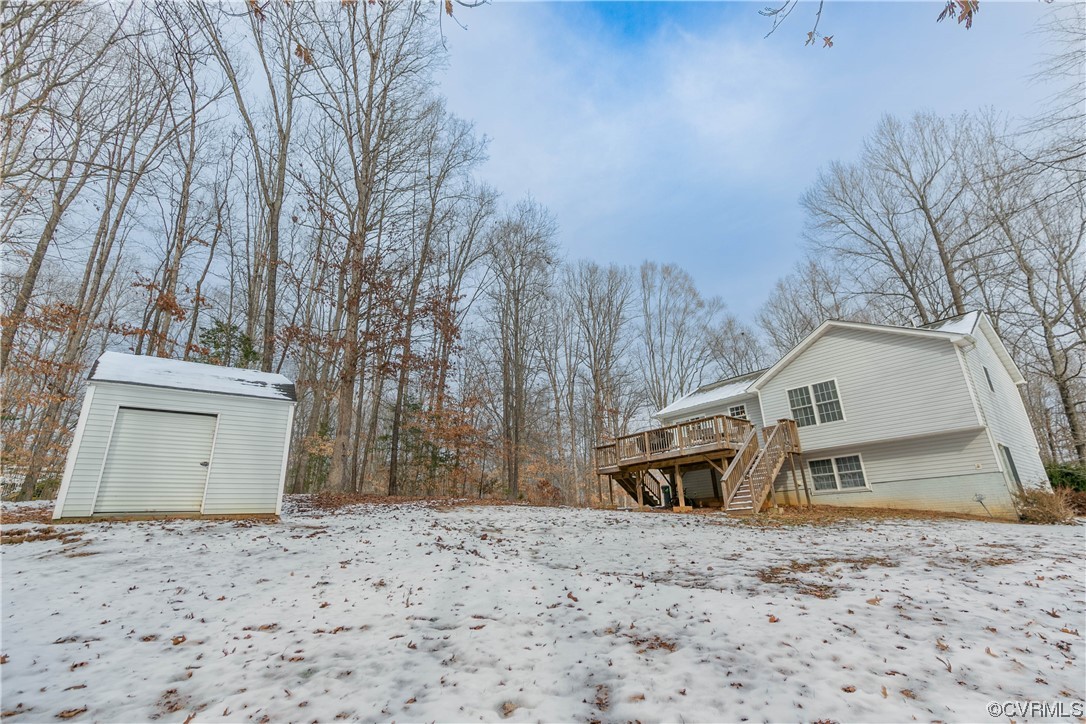 213 Cedar Ridge Drive Ruther Glen, VA 22546 - Photo 39 of 50 Yard covered in snow featuring an outdoor structur